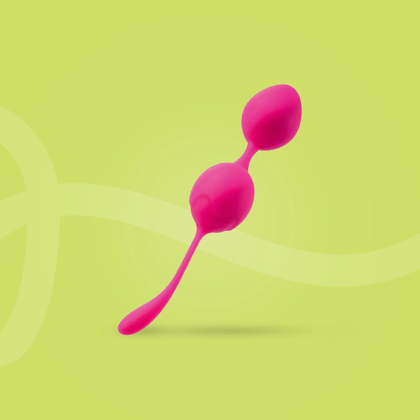 Pink silicone kegel exercise balls on a green background