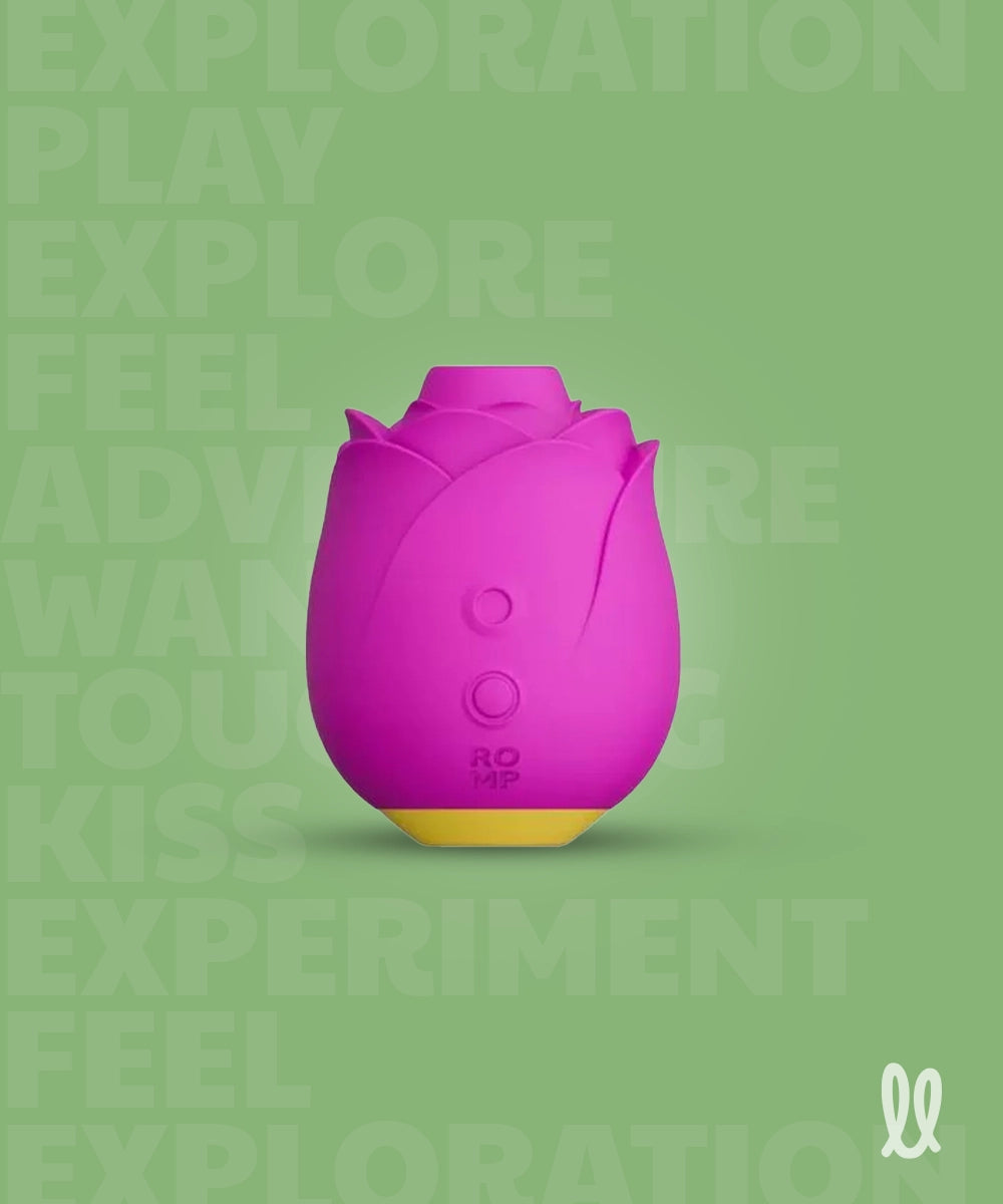 Purple clitoral stimulator shaped like a rose on a green background with text.